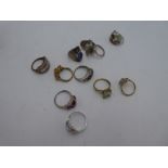 A collection of modern silver dress rings, inset with multi coloured gemstones, all marked 925