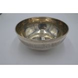 A silver Continental circular bowl with embossed border design on the body. Marked 800 on the base.