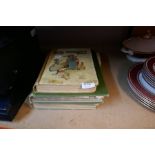 A selection of old books, including 'Peter Pan', 'Sacred Art' and 'Hans Andersen's Fairy Tales'
