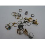 A collection of various silver dress rings inset with gemstones, including opal, turquoise and ameth