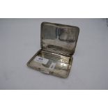 A silver cigarette box, marked 98% Silver, wire spring strap marked Hill Shenstone. Having repouss