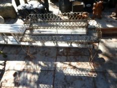 An old iron wirework style 2-tier planter