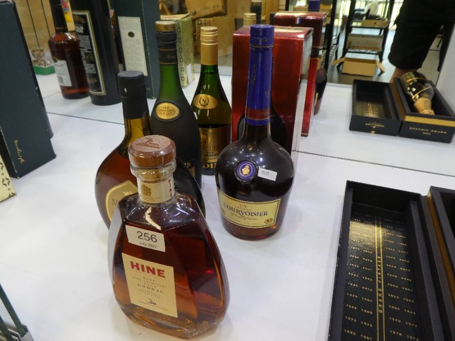 A bottle of Hine Champagne Cognac and five other bottles of Cognac