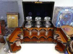 A Victorian Coromandel decanter and glass box with rising lid and two front doors by Pearson & Sons,