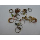 A collection of silver dress rings to include opal and multi gem examples