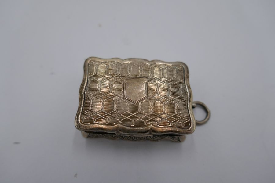 A Victorian silver Vinaigrette with central vacant cartouche and decorative engraved detail. Gilded - Image 2 of 12