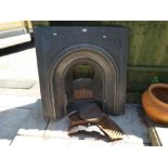 An old cast iron fireplace and grate