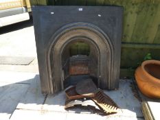 An old cast iron fireplace and grate