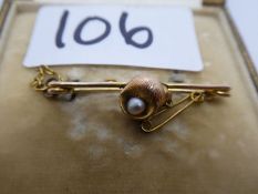 Antique yellow metal bar brooch, mounted applied shell and single pearl, with the letter C, in Bert