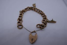 9ct yellow gold curblink bracelet, hung with 2 plated charms, marked 375, with heart shaped clasp 18