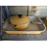 A quantity of Le Creuset enamelled pans and dishes