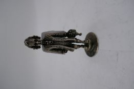 A silver miniature figure on a circular foot, having high quality detailing design, 6cm tall approx