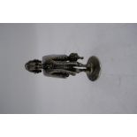 A silver miniature figure on a circular foot, having high quality detailing design, 6cm tall approx