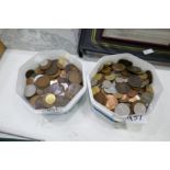 Two tubs of mixed coinage from various countries