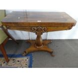 A Victorian Rosewood card table having carved decoration 91cm