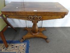 A Victorian Rosewood card table having carved decoration 91cm