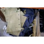 A selection of vintage Army uniforms jackets and berets, etc