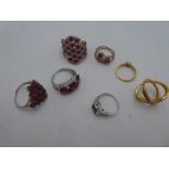 A small collection of silver ruby and diamond chip dress rings, all marked 925