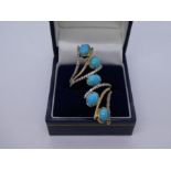 Fancy design 9ct dress ring set with turquoise and clear stones, size T, marked 375, 7.4g