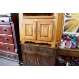 A reproduction corner TV unit and an oak sideboard having two drawers