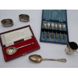 A silver cased reproduction spoon, hallmarked London 1975 C J Vander Ltd., a cased set of 800 decora