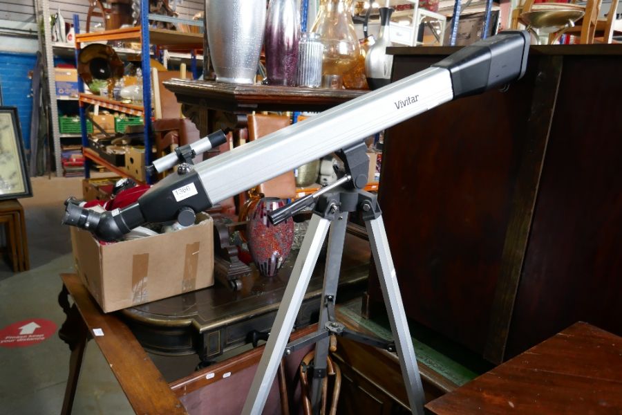A Vivitar  modern telescope on tripod