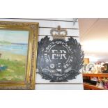 A large metal plaque depicting the insignia of The Royal Engineers