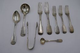 A quantity of heavy Georgian flatware to include forks, a ladle and spoon. Hallmarked London 1824-34