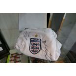 A signed England football shirt from the World Cup 2006 squad to include Beckham, Lampard and Rooney