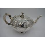 An exceptional design Victorian silver teapot heavily chased scrolls foliate design and flowers