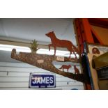 A vintage metal hanging basket bracket depicting a Vixen and her cubs