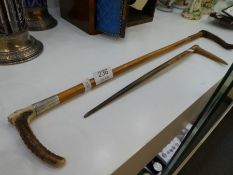 A Swaine & Co Hunting whip for a mother and child, one dated 1924, made from Antler having 18ct gold