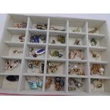 A tray of various silver earrings to include pearl, moonstone, amethyst, and other gem set examples,