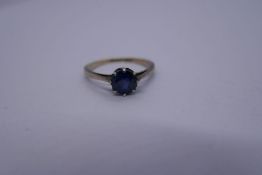 9ct yellow dress ring with a single round cut sapphire marked 9ct, Size M, 1.7g approx