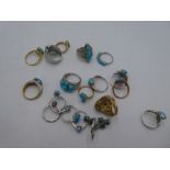 A collection of silver dress rings all inset with turquoise stones, all marked 925