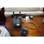 A vintage Bakelite switchboard telephone for business purposes, having 10 buttons