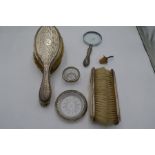 A quantity of silver items to include a pair of hand brushes, another pair of silver backed brushes.