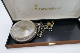 An ornate silver half hunter pocket watch with gold and silver coloured dial having Roman numerals.