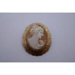 9ct gold mounted oval cameo brooch, with floral engraving, marked 375, Birmingham A & C?, 3cm x 2.5c
