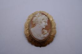 9ct gold mounted oval cameo brooch, with floral engraving, marked 375, Birmingham A & C?, 3cm x 2.5c