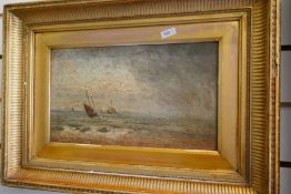 A 19th Century oil on panel of boats at sea, signed, 32 x 18.5cm
