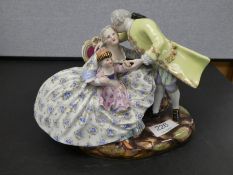 A 19th century Meissen figural group of lady, gent and child, 17.5cm