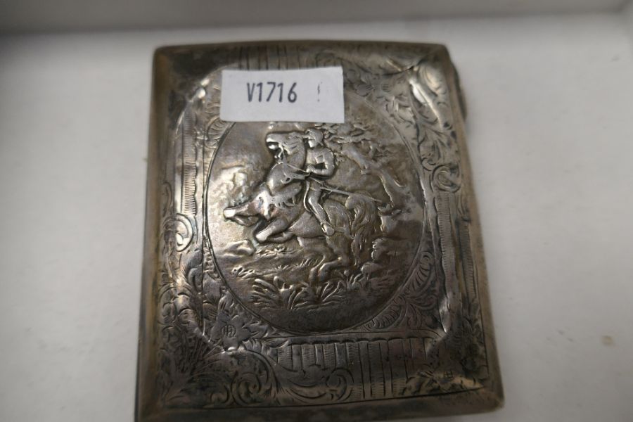 A silver embossed cigarette case with decorative scene of a figure on a horse. Gilt interior and str - Image 3 of 8