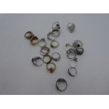 A collection of silver dress rings all set with gemstones including sapphire and diamond examples