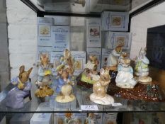 Twelve Royal Albert Beatrix potter figures with wooden stump stand (some boxed)
