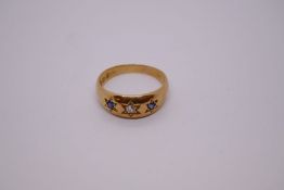 Antique 18ct gold gypsy ring, the band with central starburst set diamond and flanked with sapphire