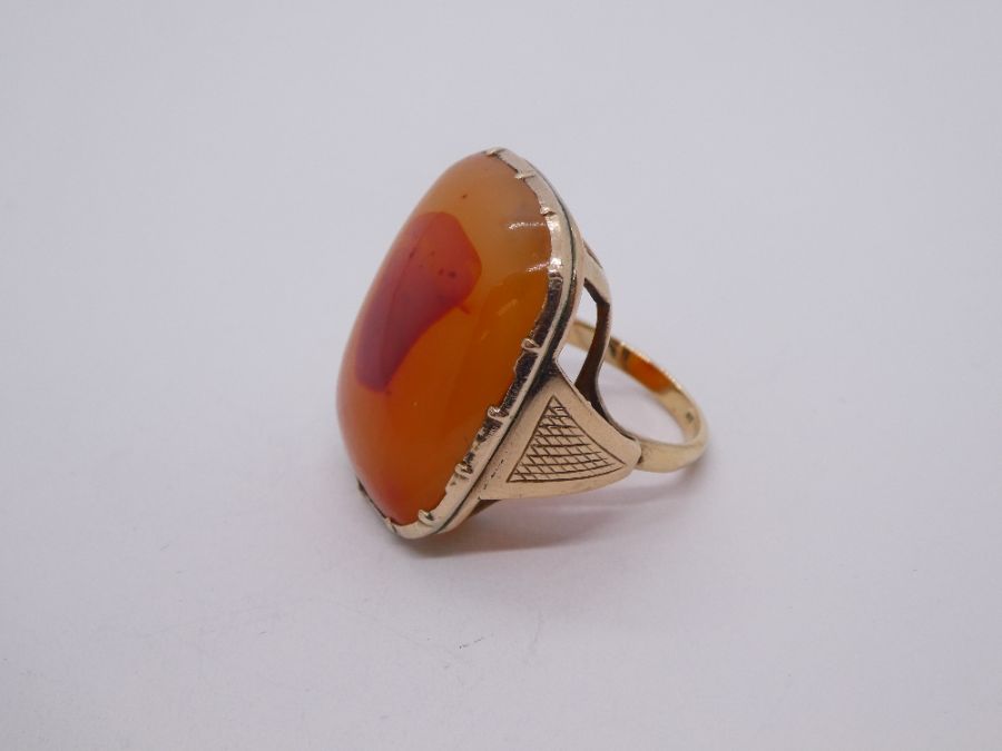 Antique yellow gold ring set with large polished cornelian, marked inside CT, size N/O