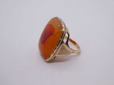 Antique yellow gold ring set with large polished cornelian, marked inside CT, size N/O