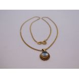 9ct yellow gold fine curblink necklace hung with oval aquamarine pendant with ropetwist frame, marke