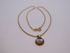 9ct yellow gold fine curblink necklace hung with oval aquamarine pendant with ropetwist frame, marke